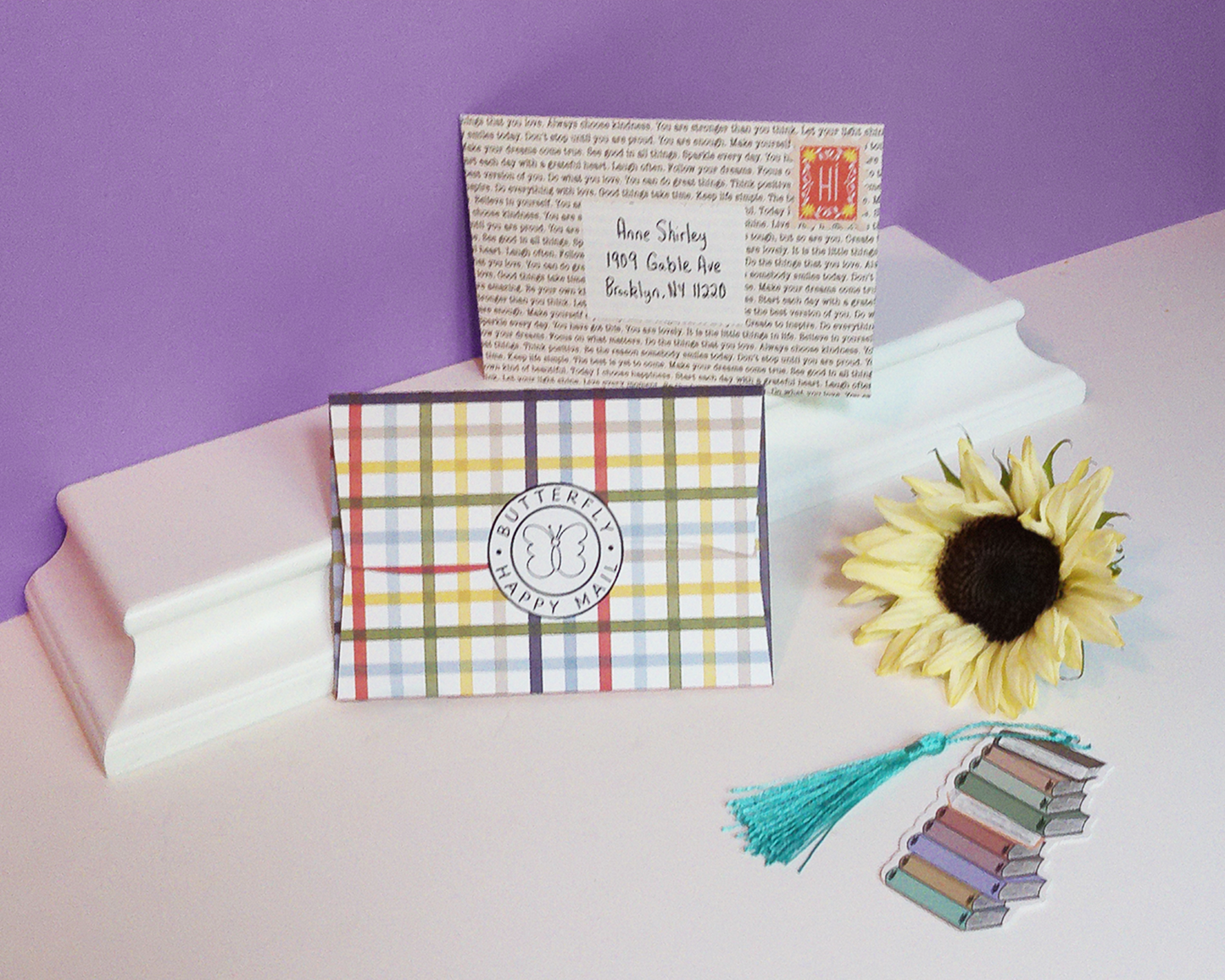 two closed cards, one with a plaid design, the other with a book paper design